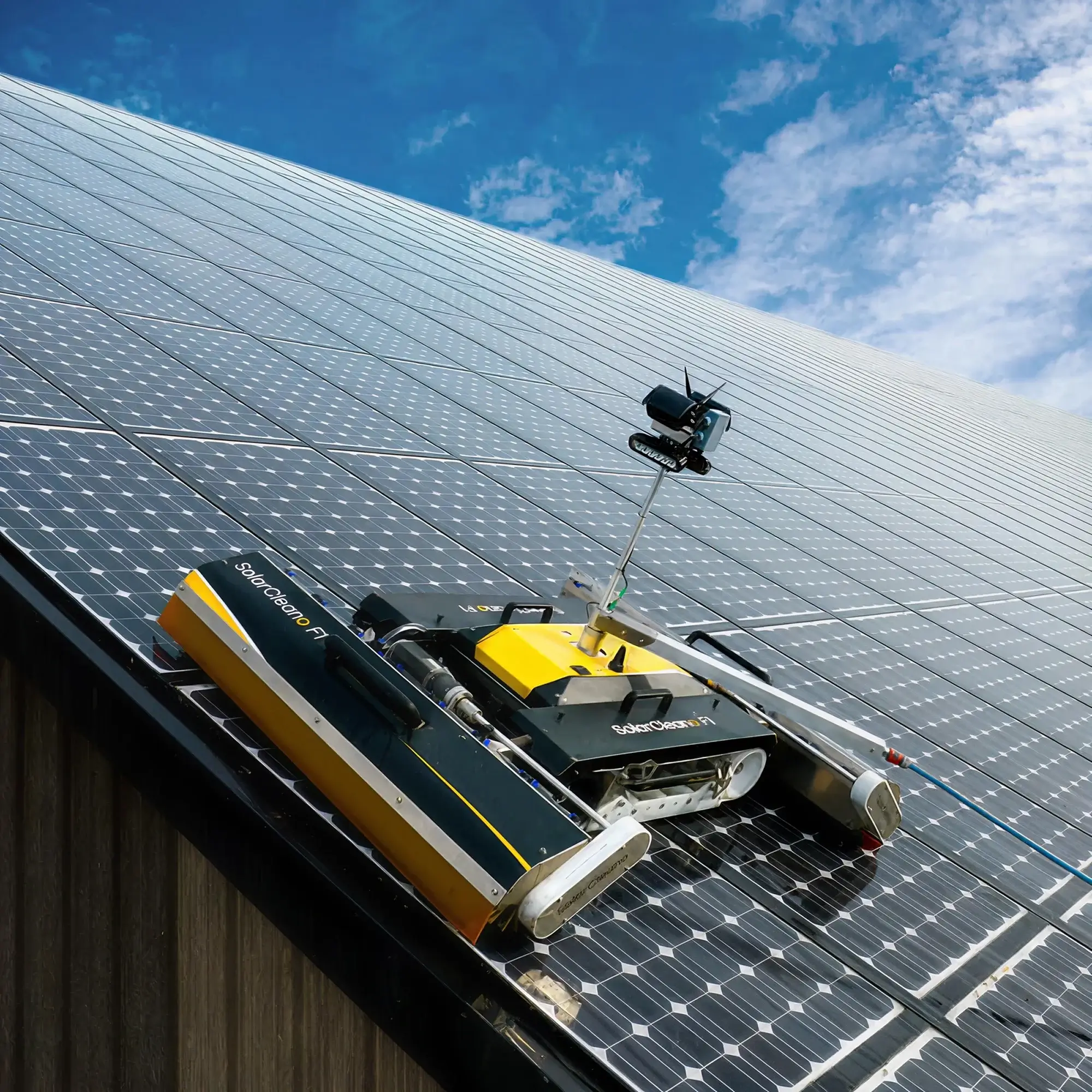 Robotic solar panel cleaning system for large commercial installations
