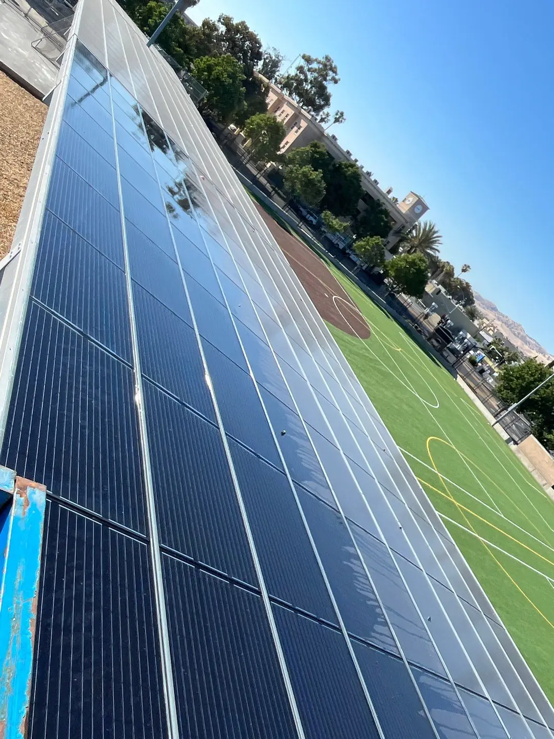 Clean solar modules on the same school carport, glass clear after deionized-water cleaning, Pittsburg CA