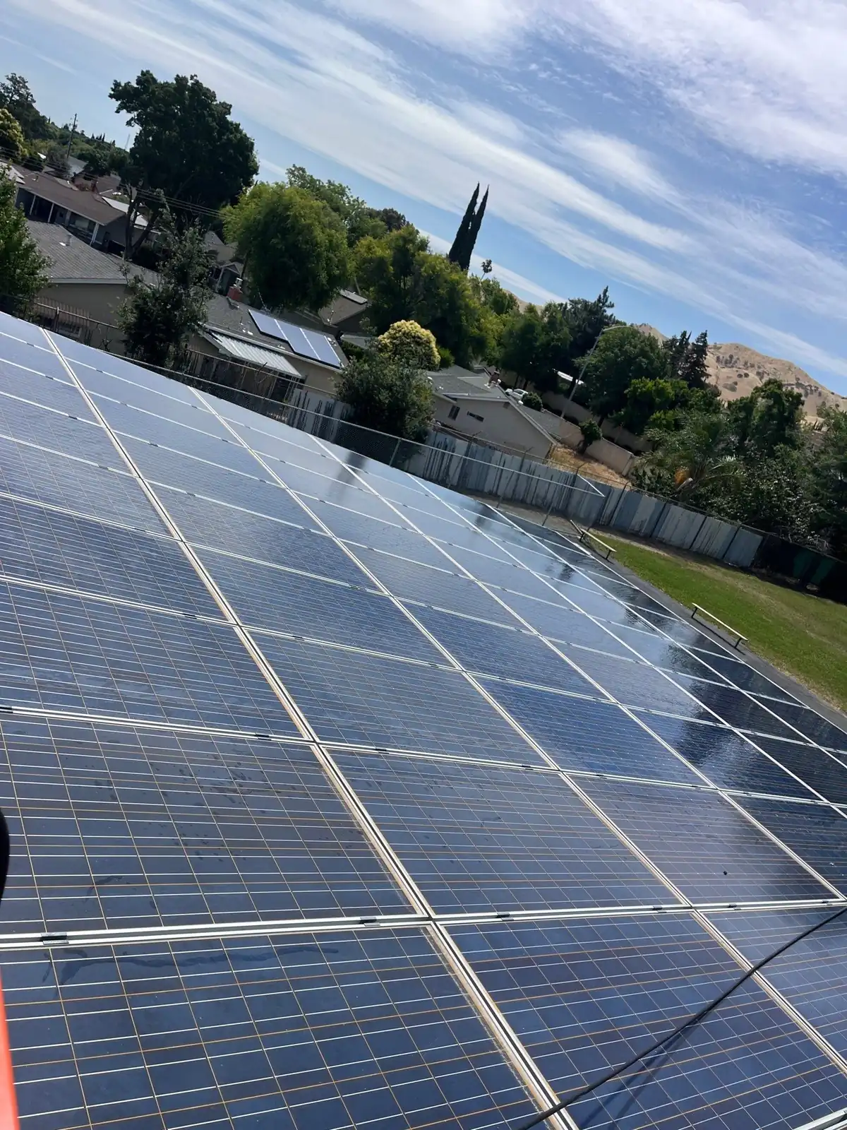 Clean solar carport at an elementary school site with hillside view in Pittsburg, CA